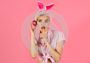 Happy Easter. Funny bunny woman with rabbit ears. Easters egg.