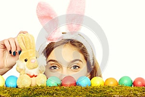 Happy easter girl in bunny ears with colorful eggs, rabbit