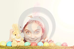 Happy easter girl in bunny ears with colorful eggs, rabbit