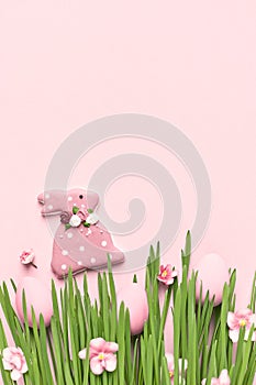 Happy Easter greeting card or background, Easter eggs and bunny in grass.