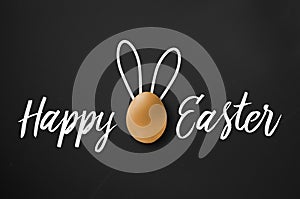 Happy easter greeting card on black chalkboard