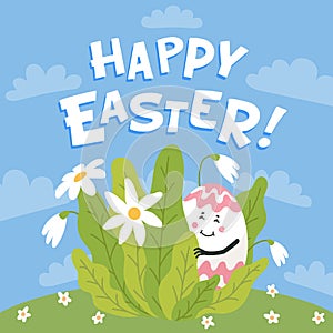 Happy easter greeting card. Colored egg with cute face hiding on a green lawn. Easter egg with funny face. Egg hunt