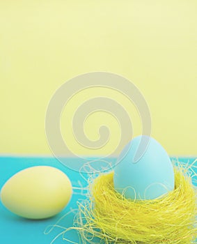 Happy Easter greeting card. Easter egg on yellow beckground with copy space