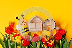 Happy Easter Greeting card, mockup for calendar date. Bouquet of colorful tulip flowers, cup of coffee and cute bee toy,