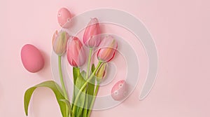 Happy Easter greeting card. Pastel color egg and tulip flower on pink. Spring Holiday celebration