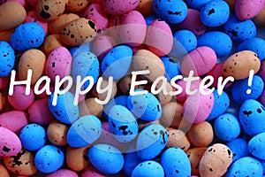 Happy easter greetings with many colourful eastereggs