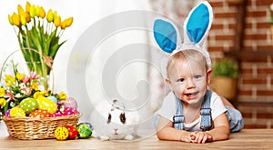 Happy easter! happy funny baby boy playing with bunny