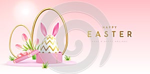 Happy Easter holiday background with gift box and Easter egg with rabbit ears.