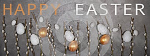 HAPPY EASTER holiday celebration backgroud greeting card with text - Golden painted easter eggs and catkins on concrete table