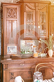 happy easter holiday in springtime season. festive home decor. antique vintage carved wooden kitchen counter