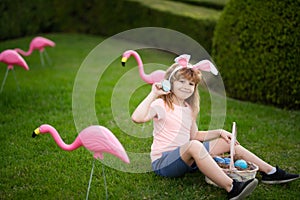 Happy Easter. Kids in bunny ears with Easter egg in basket. Boy play in hunting eggs. Easter egg hunt.