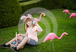 Happy Easter. Kids in bunny ears with Easter egg in basket. Boy play in hunting eggs. Easter egg hunt.