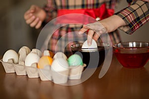 Happy easter. Little girl painter painted eggs. Kid preparing for Easter. Painted hand. Finger paint. Art and craft concept