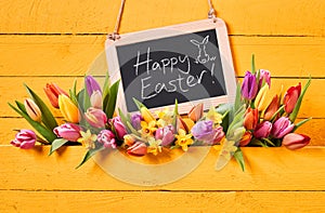 Happy Easter message with fresh spring tulips