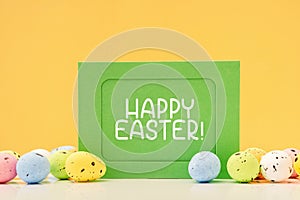 Happy Easter mockup card with eggs on yellow