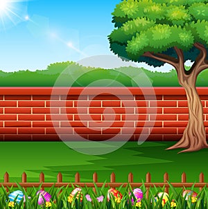 Happy easter on the nature with a brick fence background