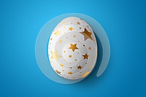 Happy Easter, painted Easter egg on a blue background. White gold pattern.