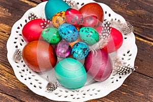 Happy Easter. painted eggs of different colors on a wooden table, Easter decoration