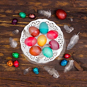 Happy Easter. painted eggs of different colors on a wooden table, Easter decoration,