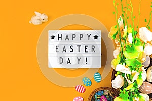 Happy Easter photo background with greeting message and easter eggs and flowers decoration