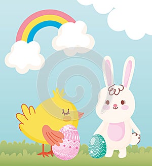 Happy easter rabbit and chicken with eggs in grass rainbow clouds