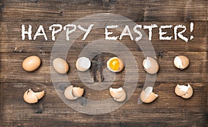 Happy Easter Raw eggs wooden background