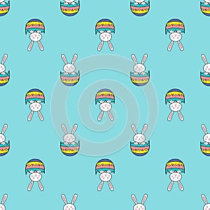 Happy Easter seamless pattern with rabbit in egg shell on blue background illustration. Cute cartoon character.