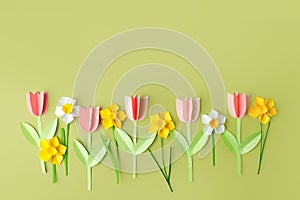 Happy easter spring concet - papercraft seasonal flowers on blue background for kids holiday party concept background. Handicrafts