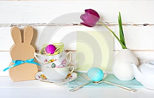 Happy Easter Tea Party or Meal Invite Card with Tea Cups, Bunny, Flower, Egg and Silverware in Modern Whimsical Arrangement