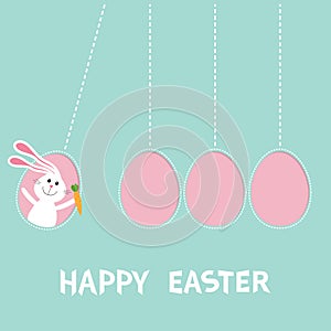Happy Easter text. Hanging pink painting egg set. Bunny rabbit hare holding carrot. Dash line. Perpetual motion mobile. Greeting c