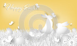 Happy Easter text with rainbow egg and a rabbit on grass, butterfly and flower in the garden