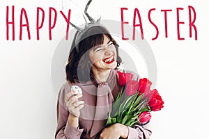 Happy Easter text. season`s greetings card. Beautiful happy girl