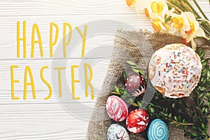 Happy easter text. season`s greetings card. stylish painted eggs
