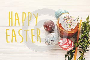 Happy easter text. season`s greetings card. stylish painted eggs