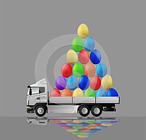 Happy easter. The truck carries a mountain of colored eggs for the holiday.