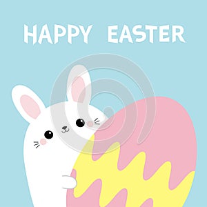 Happy Easter. White bunny rabbit holding big painted egg. Happy Easter. Funny head face, eyes, ears. Cute kawaii cartoon character
