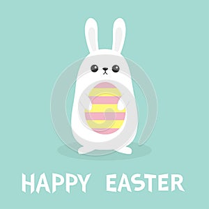 Happy Easter. White bunny rabbit holding painted pattern egg. Funny head face. Big ears. Cute kawaii cartoon character. Baby greet