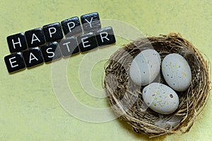 Happy easter wishes with nest and eggs