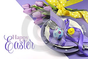 Happy Easter yellow and purple mauve lilac theme easter table place setting photo