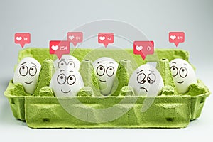 Happy eggs with many likes, one sad egg without likes. Social networks