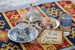Happy eid al adna text in turkish on greeting card