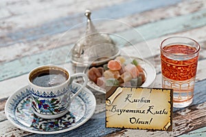 Happy eid al adna text in turkish on greeting card with turkish