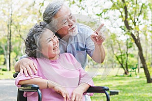 Happy elderly couple with lifestyle after retiree concept. Lovely asian seniors couple embracing together in the park.