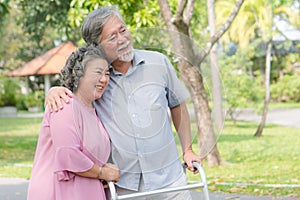 Happy elderly couple with lifestyle after retiree concept. Lovely asian seniors couple embracing together in the park.