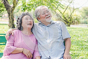 Happy elderly couple with lifestyle after retiree concept. Lovely asian seniors couple embracing together in the park.