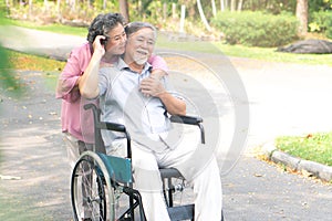 Happy elderly couple with lifestyle after retiree concept. Lovely asian seniors couple embracing together in the park.