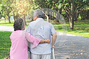 Happy elderly couple with lifestyle after retiree concept. Lovely asian seniors couple embracing together in the park.