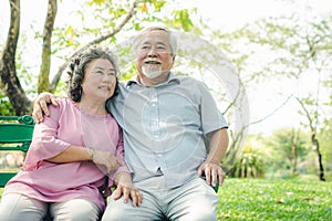 Happy elderly couple with lifestyle after retiree concept. Lovely asian seniors couple embracing together in the park.