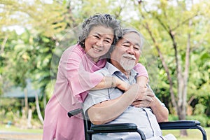 Happy elderly couple with lifestyle after retiree concept. Lovely asian seniors couple embracing together in the park.