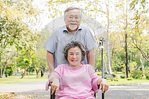 Happy elderly couple with lifestyle after retiree concept. Lovely asian seniors couple embracing together in the park.